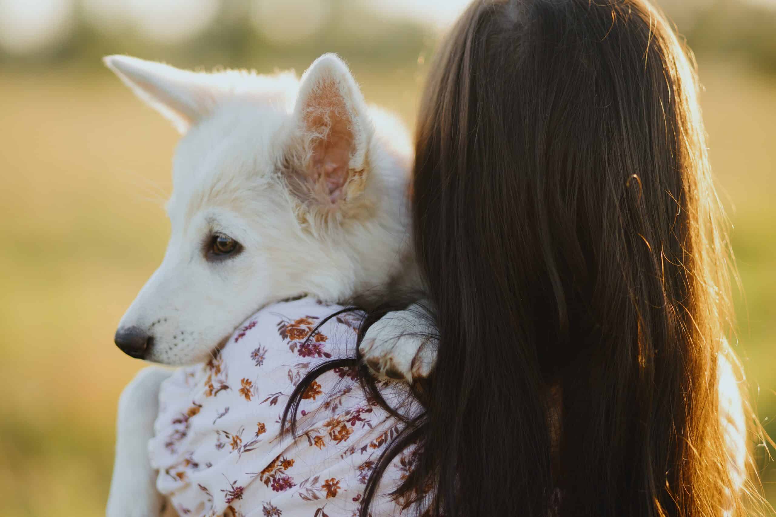 woman hugging dog