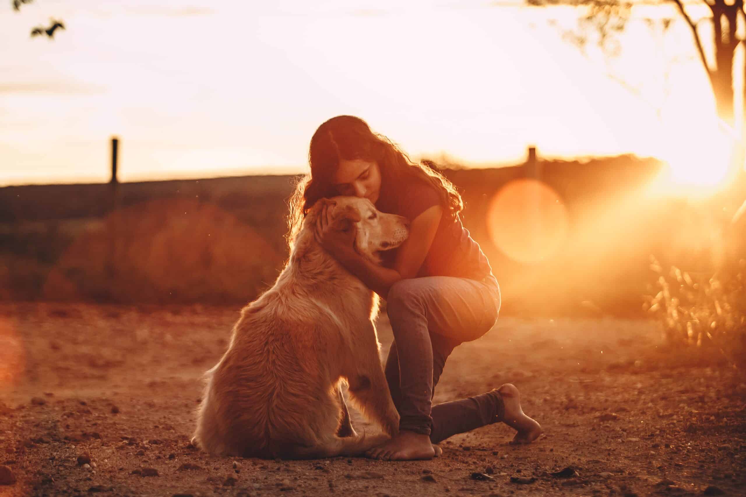 woman hugging dog